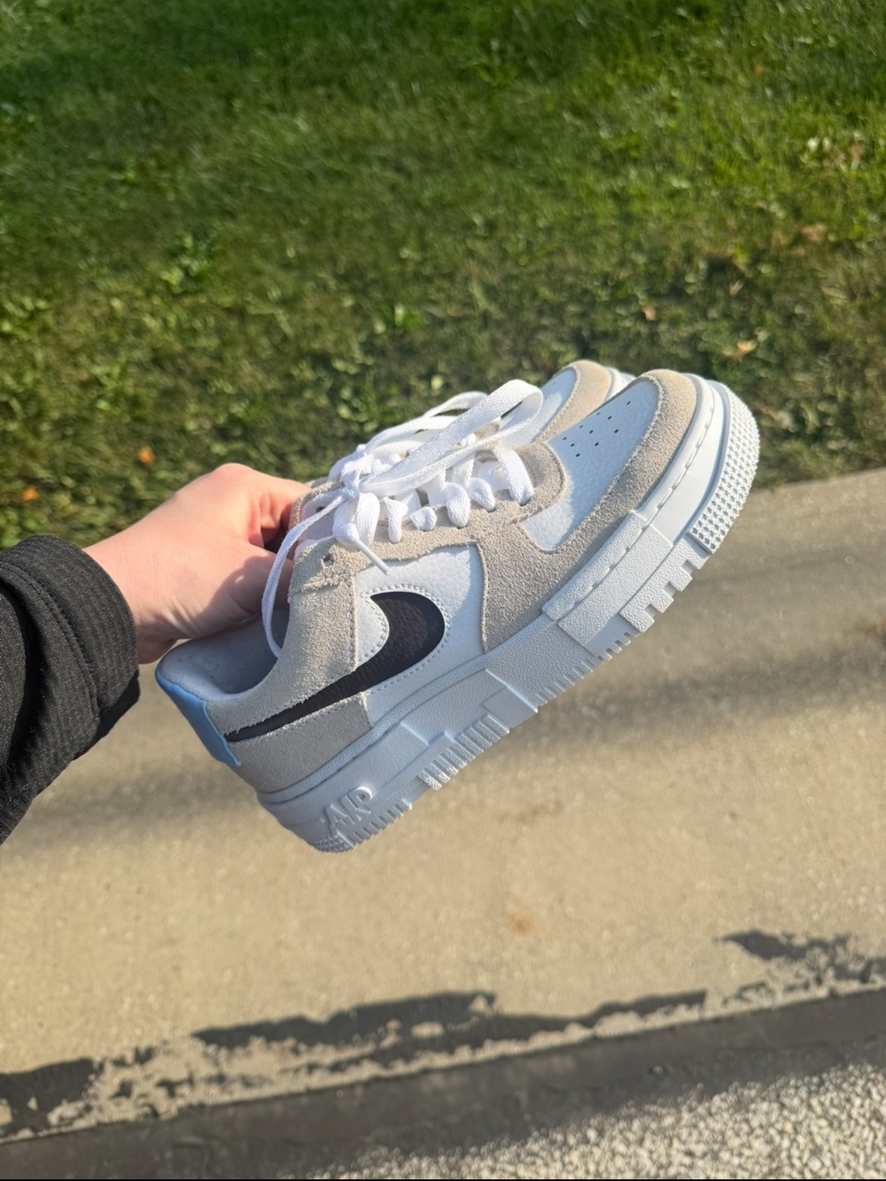 Nike White and Light Gray Sneakers with Black Swoosh